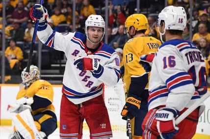 Dec 2, 2023; Nashville, Tennessee, USA; New York Rangers defenseman Jacob Trouba (8) celebrates after a goal against Nashville Predators goaltender Kevin Lankinen (32) during the second period at Bridgestone Arena. Mandatory Credit: Christopher Hanewinckel-USA TODAY Sports