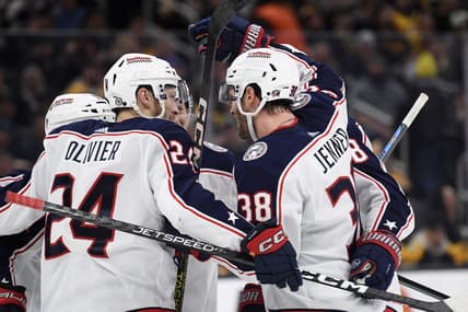 Dec 3, 2023; Boston, Massachusetts, USA; Columbus Blue Jackets center Boone Jenner (38) celebrates his goal with right wing Mathieu Olivier (24) and the rest of his line mates during the second period against the Boston Bruins at TD Garden. Mandatory Credit: Bob DeChiara-USA TODAY Sports