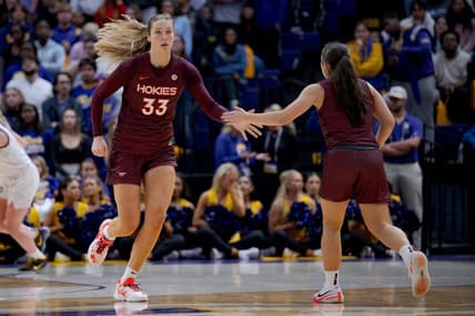 Nov 30, 2023; Baton Rouge, Louisiana, USA;  Virginia Tech Hokies center Elizabeth Kitley (33) slaps hands with Virginia Tech Hokies guard Georgia Amoore (5) against the LSU Lady Tigers during the second half at Pete Maravich Assembly Center. Mandatory Credit: Matthew Hinton-USA TODAY Sports