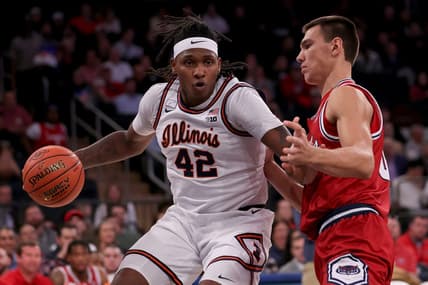 Dec 5, 2023; New York, New York, USA; Illinois Fighting Illini forward Dain Dainja (42) controls the ball against Florida Atlantic Owls center Vladislav Goldin (50) during the first half at Madison Square Garden. Mandatory Credit: Brad Penner-USA TODAY Sports