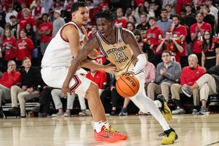 Dec 5, 2023; Athens, Georgia, USA; Georgia Tech Yellow Jackets guard Miles Kelly (13) dribbles against Georgia Bulldogs guard RJ Melendez (15) during the second half at Stegeman Coliseum. Mandatory Credit: Dale Zanine-USA TODAY Sports