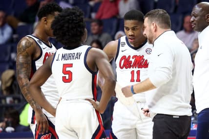 Dec 5, 2023; Oxford, Mississippi, USA; Mississippi Rebels guard TJ Caldwell (2), guard Jaylen Murray (5), guard Matthew Murrell (11) and head coach Chris Beard (right) huddle during a time out during the second half against the Mount St. Mary's Mountaineers at The Sandy and John Black Pavilion at Ole Miss. Mandatory Credit: Petre Thomas-USA TODAY Sports