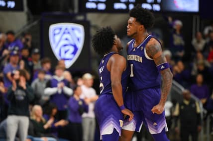 Dec 9, 2023; Seattle, Washington, USA; Washington Huskies guard Sahvir Wheeler (5) and forward Keion Brooks Jr. (1) celebrate after a scored against the Gonzaga Bulldogs during the second half at Alaska Airlines Arena at Hec Edmundson Pavilion. Mandatory Credit: Steven Bisig-USA TODAY Sports