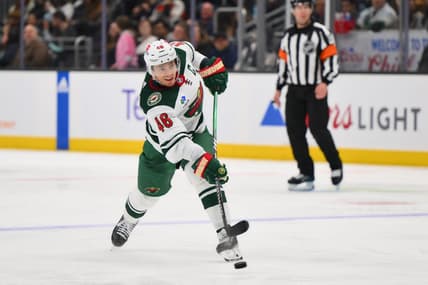 Dec 10, 2023; Seattle, Washington, USA; Minnesota Wild defenseman Jared Spurgeon (46) shoots the puck against the Seattle Kraken during the third period at Climate Pledge Arena. Mandatory Credit: Steven Bisig-USA TODAY Sports