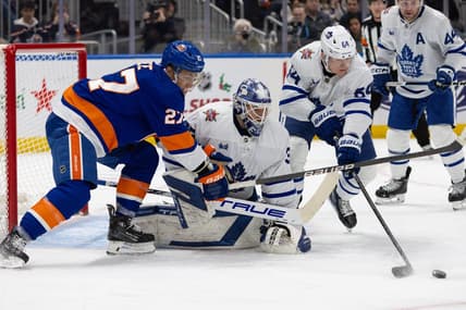 Dec 11, 2023; Elmont, New York, USA; Toronto Maple Leafs goaltender Ilya Samsonov (35) tracked the puck while New York Islanders left wing Anders Lee (27) attempts to score during the second period at UBS Arena. Mandatory Credit: Thomas Salus-USA TODAY Sports