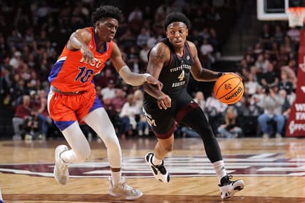 Dec 22, 2023; College Station, Texas, USA; Texas A&M Aggies guard Wade Taylor IV (4) handles the ball against Houston Christian Huskies guard Marcus Greene (10) during the first half at Reed Arena. Mandatory Credit: Erik Williams-USA TODAY Sports
