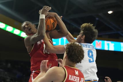 Dec 22, 2023; Los Angeles, California, USA; Maryland Terrapins forward Julian Reese (10) and UCLA Bruins forward Berke Buyuktuncel (9) battle for the ball in the second half at Pauley Pavilion presented by Wescom. Mandatory Credit: Kirby Lee-USA TODAY Sports