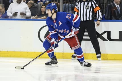 Dec 27, 2023; New York, New York, USA; New York Rangers defenseman Adam Fox (23) controls the puck in the third period against the Washington Capitals at Madison Square Garden. Mandatory Credit: Wendell Cruz-USA TODAY Sports