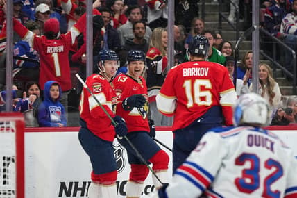 Dec 29, 2023; Sunrise, Florida, USA; Florida Panthers center Sam Reinhart (13) celebrates his goal on New York Rangers goaltender Jonathan Quick (32) with center Carter Verhaeghe (23) and center Aleksander Barkov (16) during the second period at Amerant Bank Arena. Mandatory Credit: Jasen Vinlove-USA TODAY Sports