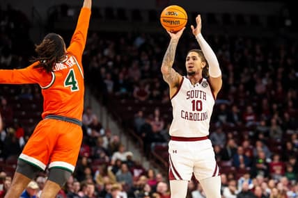 Dec 30, 2023; Columbia, South Carolina, USA; South Carolina Gamecocks guard Myles Stute (10) shoots over Florida A&M Rattlers guard Hantz Louis-Jeune (4) in the first quarter at Colonial Life Arena. Mandatory Credit: Jeff Blake-USA TODAY Sports
