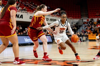 Dec 30, 2023; Stillwater, Okla, USA ; Oklahoma State Cowgirls guard Stailee Heard (32) drives past Iowa State Cyclones forward Addy Brown (24) in the first half of an NCAA women  s basketball game at Gallagher Iba arena. Mandatory Credit: Mitch Alcala-The Oklahoman