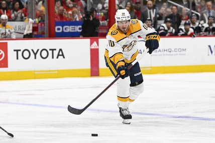 Dec 30, 2023; Washington, District of Columbia, USA; Nashville Predators center Colton Sissons (10) passes the puck against the Washington Capitals during the second period at Capital One Arena. Mandatory Credit: Brad Mills-USA TODAY Sports