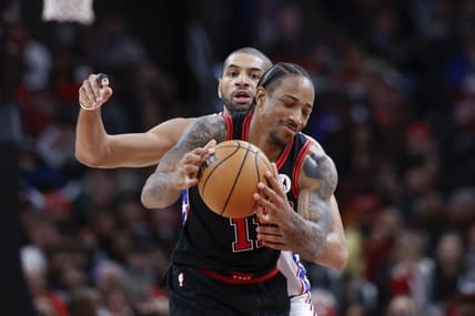 Dec 30, 2023; Chicago, Illinois, USA; Philadelphia 76ers forward Nicolas Batum (40) defends against Chicago Bulls forward DeMar DeRozan (11) during the second half at United Center. Mandatory Credit: Kamil Krzaczynski-USA TODAY Sports