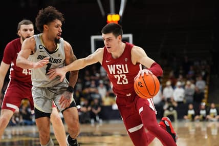 Dec 31, 2023; Boulder, Colorado, USA; Washington State Cougars forward Andrej Jakimovski (23) drives at Colorado Buffaloes guard J'Vonne Hadley (1)in the first half at the CU Events Center. Mandatory Credit: Ron Chenoy-USA TODAY Sports