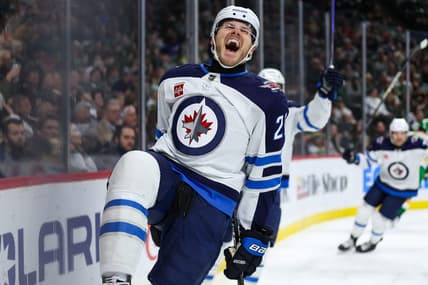 Dec 31, 2023; Saint Paul, Minnesota, USA; Winnipeg Jets center Dominic Toninato (21) celebrates his goal against the Minnesota Wild during the third period at Xcel Energy Center. Mandatory Credit: Matt Krohn-USA TODAY Sports