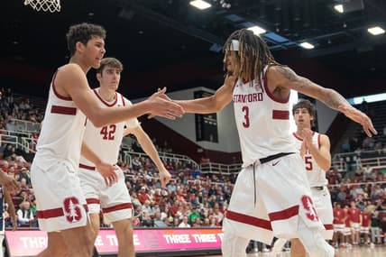 Dec 31, 2023; Stanford, California, USA; Stanford Cardinal guard Kanaan Carlyle (3) celebrates with forward Brandon Angel (23) and his teammates during the second half against the Arizona Wildcats at Maples Pavilion. Mandatory Credit: Stan Szeto-USA TODAY Sports
