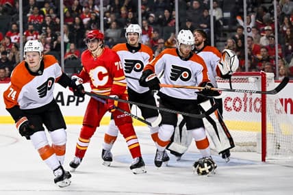 Dec 31, 2023; Calgary, Alberta, CAN; Philadelphia Flyers goaltender Samuel Ersson (33) pulls off his mask during the third period in a game against the Calgary Flames at Scotiabank Saddledome. Mandatory Credit: Brett Holmes-USA TODAY Sports