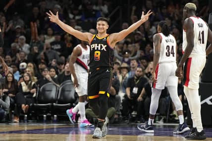 Jan 1, 2024; Phoenix, Arizona, USA; Phoenix Suns guard Grayson Allen (8) reacts after guard Devin Booker (1) makes a basket against the Portland Trail Blazers in the second half at Footprint Center. Mandatory Credit: Rick Scuteri-USA TODAY Sports
