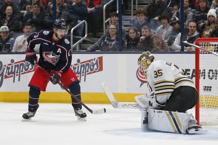 Jan 2, 2024; Columbus, Ohio, USA; Boston Bruins goalie Linus Ullmark (35) makes a save as Columbus Blue Jackets left wing Johnny Gaudreau (13) looks for a rebound during the first period at Nationwide Arena. Mandatory Credit: Russell LaBounty-USA TODAY Sports