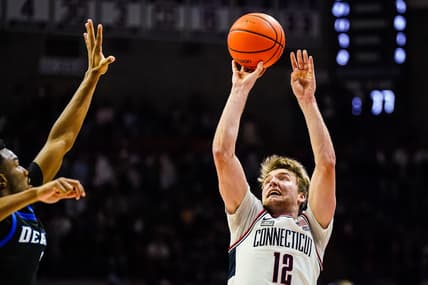 Jan 2, 2024; Storrs, Connecticut, USA; Connecticut Huskies guard Cam Spencer (12) shoot the ball against the DePaul Blue Demons in the second half at Harry A. Gampel Pavilion. Mandatory Credit: David Butler II-USA TODAY Sports