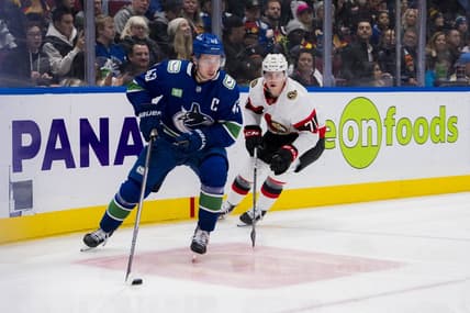 Jan 2, 2024; Vancouver, British Columbia, CAN; Ottawa Senators forward Ridly Greig (71) pursues Vancouver Canucks defenseman Quinn Hughes (43) in the second period at Rogers Arena. Mandatory Credit: Bob Frid-USA TODAY Sports