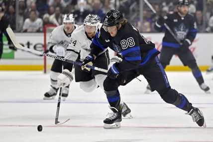 Jan 2, 2024; Los Angeles, California, USA; Toronto Maple Leafs right wing William Nylander (88) skates the puck past Los Angeles Kings defenseman Vladislav Gavrikov (84) in the first period at Crypto.com Arena. Mandatory Credit: Jayne Kamin-Oncea-USA TODAY Sports