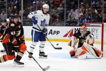 Jan 3, 2024; Anaheim, California, USA; Anaheim Ducks goaltender Lukas Dostal (1) blocks a shot  during the first period against the Toronto Maple Leafs at Honda Center. Mandatory Credit: Kiyoshi Mio-USA TODAY Sports