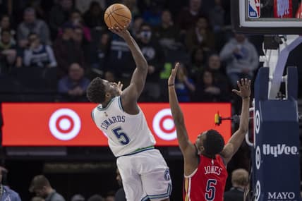 Jan 3, 2024; Minneapolis, Minnesota, USA; Minnesota Timberwolves guard Anthony Edwards (5) shoots the ball over New Orleans Pelicans forward Herbert Jones (5) in the second half at Target Center. Mandatory Credit: Jesse Johnson-USA TODAY Sports