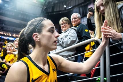 Iowa guard Caitlin Clark greets fans after defeating Cleveland State.