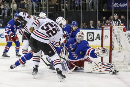 Jan 4, 2024; New York, New York, USA; New York Rangers goaltender Igor Shesterkin (31) makes a save on a shot on goal attempt by Chicago Blackhawks center Reese Johnson (52) at Madison Square Garden. Mandatory Credit: Wendell Cruz-USA TODAY Sports
