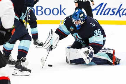 Jan 4, 2024; Seattle, Washington, USA; Seattle Kraken goaltender Joey Daccord (35) collects the puck during the first period against the Ottawa Senators at Climate Pledge Arena. Mandatory Credit: Joe Nicholson-USA TODAY Sports