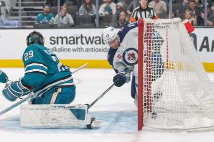 Jan 4, 2024; San Jose, California, USA; Winnipeg Jets center Gabriel Vilardi (13) deflects the puck into the goal during the third period against San Jose Sharks goaltender Mackenzie Blackwood (29) at SAP Center at San Jose. Mandatory Credit: Stan Szeto-USA TODAY Sports