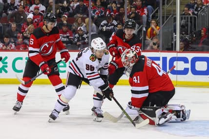 Jan 5, 2024; Newark, New Jersey, USA; New Jersey Devils goaltender Vitek Vanecek (41) makes a save while Chicago Blackhawks center Connor Bedard (98) looks for the rebound during the first period at Prudential Center. Mandatory Credit: Ed Mulholland-USA TODAY Sports