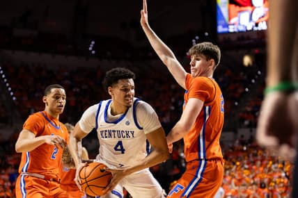 Jan 6, 2024; Gainesville, Florida, USA; Kentucky Wildcats forward Tre Mitchell (4) battles with Florida Gators forward Alex Condon (21) during the first half at Exactech Arena at the Stephen C. O'Connell Center. Mandatory Credit: Matt Pendleton-USA TODAY Sports