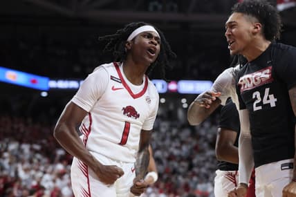 Jan 6, 2024; Fayetteville, Arkansas, USA; Arkansas Razorbacks guard Keyon Menifield Jr (1) celebrates after making a three point shot in the first half against the Auburn Tigers at Bud Walton Arena. Mandatory Credit: Nelson Chenault-USA TODAY Sports