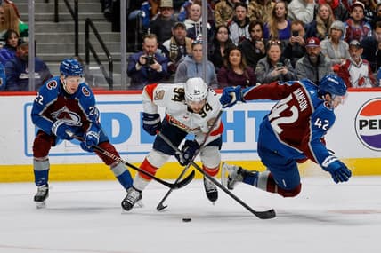 Jan 6, 2024; Denver, Colorado, USA; Florida Panthers left wing Ryan Lomberg (94) gets tied up with Colorado Avalanche left wing Fredrik Olofsson (22) and defenseman Josh Manson (42) in the first period at Ball Arena. Mandatory Credit: Isaiah J. Downing-USA TODAY Sports