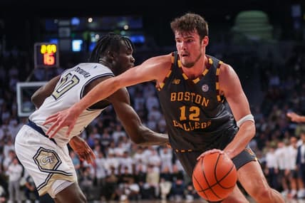 Jan 6, 2024; Atlanta, Georgia, USA; Boston College Eagles forward Quinten Post (12) drives on Georgia Tech Yellow Jackets forward Ebenezer Dowuona (10) in the first half at McCamish Pavilion. Mandatory Credit: Brett Davis-USA TODAY Sports