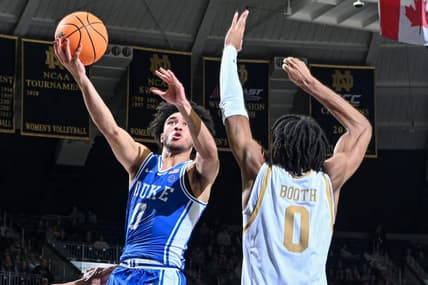 Jan 6, 2024; South Bend, Indiana, USA; Duke Blue Devils guard Jared McCain (0) goes up for a shot as Notre Dame Fighting Irish forward Carey Booth (0) defends in the second half at the Purcell Pavilion.  Mandatory Credit: Matt Cashore-USA TODAY Sports