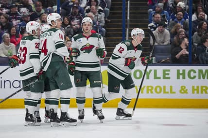 Jan 6, 2024; Columbus, Ohio, USA;  Minnesota Wild left wing Matt Boldy (12) celebrates with teammates after scoring a goal against the Columbus Blue Jackets in the second period at Nationwide Arena. Mandatory Credit: Aaron Doster-USA TODAY Sports