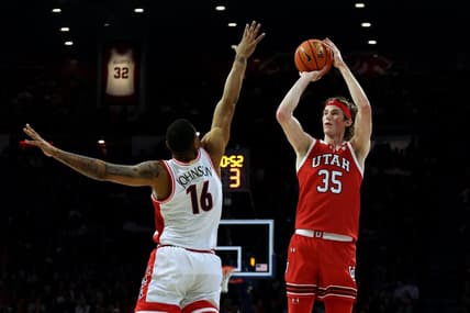 Jan 6, 2024; Tucson, Arizona, USA; Utah Utes center Branden Carlson (35) shoots a basket against Arizona Wildcats forward Keshad Johnson (16) during the first half at McKale Center. Mandatory Credit: Zachary BonDurant-USA TODAY Sports