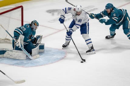 Jan 6, 2024; San Jose, California, USA; Toronto Maple Leafs center John Tavares (91) passes the puck to Toronto Maple Leafs right wing William Nylander (not pictured) in front of San Jose Sharks goaltender Mackenzie Blackwood (29) during the third period at SAP Center at San Jose. Mandatory Credit: Neville E. Guard-USA TODAY Sports