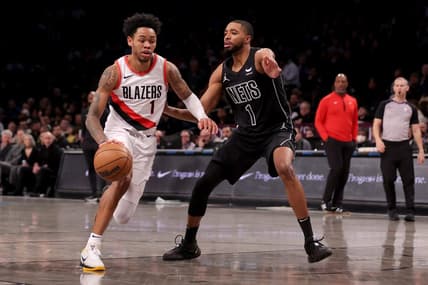 Jan 7, 2024; Brooklyn, New York, USA; Portland Trail Blazers guard Anfernee Simons (1) drives to the basket against Brooklyn Nets forward Mikal Bridges (1) during the first quarter at Barclays Center. Mandatory Credit: Brad Penner-USA TODAY Sports