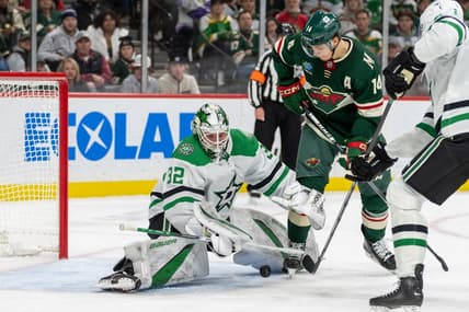 Jan 8, 2024; Saint Paul, Minnesota, USA; Dallas Stars goaltender Matt Murray (32) makes a save on Minnesota Wild center Joel Eriksson Ek (14) in the second period at Xcel Energy Center. Mandatory Credit: Matt Blewett-USA TODAY Sports