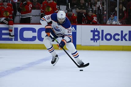 Jan 9, 2024; Chicago, Illinois, USA;  Edmonton Oilers center Leon Draisaitl (29) moves the puck against the Chicago Blackhawks during the first period at the United Center. Mandatory Credit: Matt Marton-USA TODAY Sports