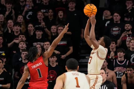 Texas Longhorns guard Max Abmas (3) shoots the go-ahead basket for the win in the second half of the NCAA Big 12 basketball game between the Cincinnati Bearcats and the Texas Longhorns at Fifth Third Arena in Cincinnati on Tuesday, Jan. 9, 2024. Texas pulled off a 74-73 win on a go-ahead basket in the final seconds of the game.