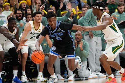 Jan 9, 2024; Waco, Texas, USA;  Brigham Young Cougars guard Jaxson Robinson (2) controls the ball against Baylor Bears guard Ja'Kobe Walter (4) during the first half at Paul and Alejandra Foster Pavilion. Mandatory Credit: Chris Jones-USA TODAY Sports
