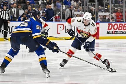Jan 9, 2024; St. Louis, Missouri, USA;  Florida Panthers left wing Matthew Tkachuk (19) controls the puck as St. Louis Blues defenseman Colton Parayko (55) defends during the third period at Enterprise Center. Mandatory Credit: Jeff Curry-USA TODAY Sports