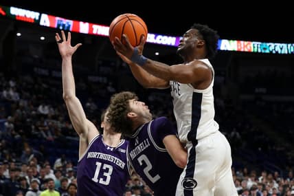Jan 10, 2024; University Park, Pennsylvania, USA; Penn State Nittany Lions guard Kanye Clary (0) drives the ball to the basket while being fouled by Northwestern Wildcats forward Nick Martinelli (2) during the first half at Bryce Jordan Center. Mandatory Credit: Matthew O'Haren-USA TODAY Sports
