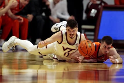 Jan 10, 2024; Blacksburg, Virginia, USA; Virginia Tech Hokies guard Hunter Cattoor (0) and Clemson Tigers guard Joseph Girard III (11) go for the ball during the first half at Cassell Coliseum. Mandatory Credit: Peter Casey-USA TODAY Sports