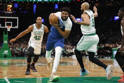 Jan 10, 2024; Boston, Massachusetts, USA; Minnesota Timberwolves center Karl-Anthony Towns (32) drives on Boston Celtics guard Derrick White (9) during the second quarter at TD Garden. Mandatory Credit: Winslow Townson-USA TODAY Sports